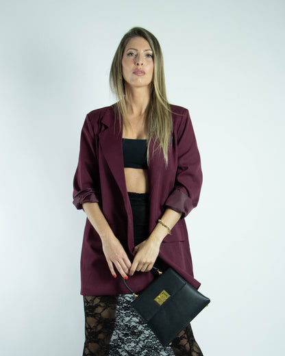 Cinco blazers oversized femininos pendurados em várias cores disponíveis.

